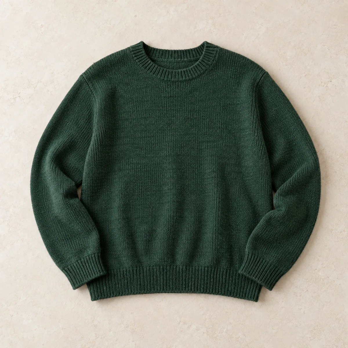 The same green jumper after FlipFast: flat, evenly lit, on a clean background